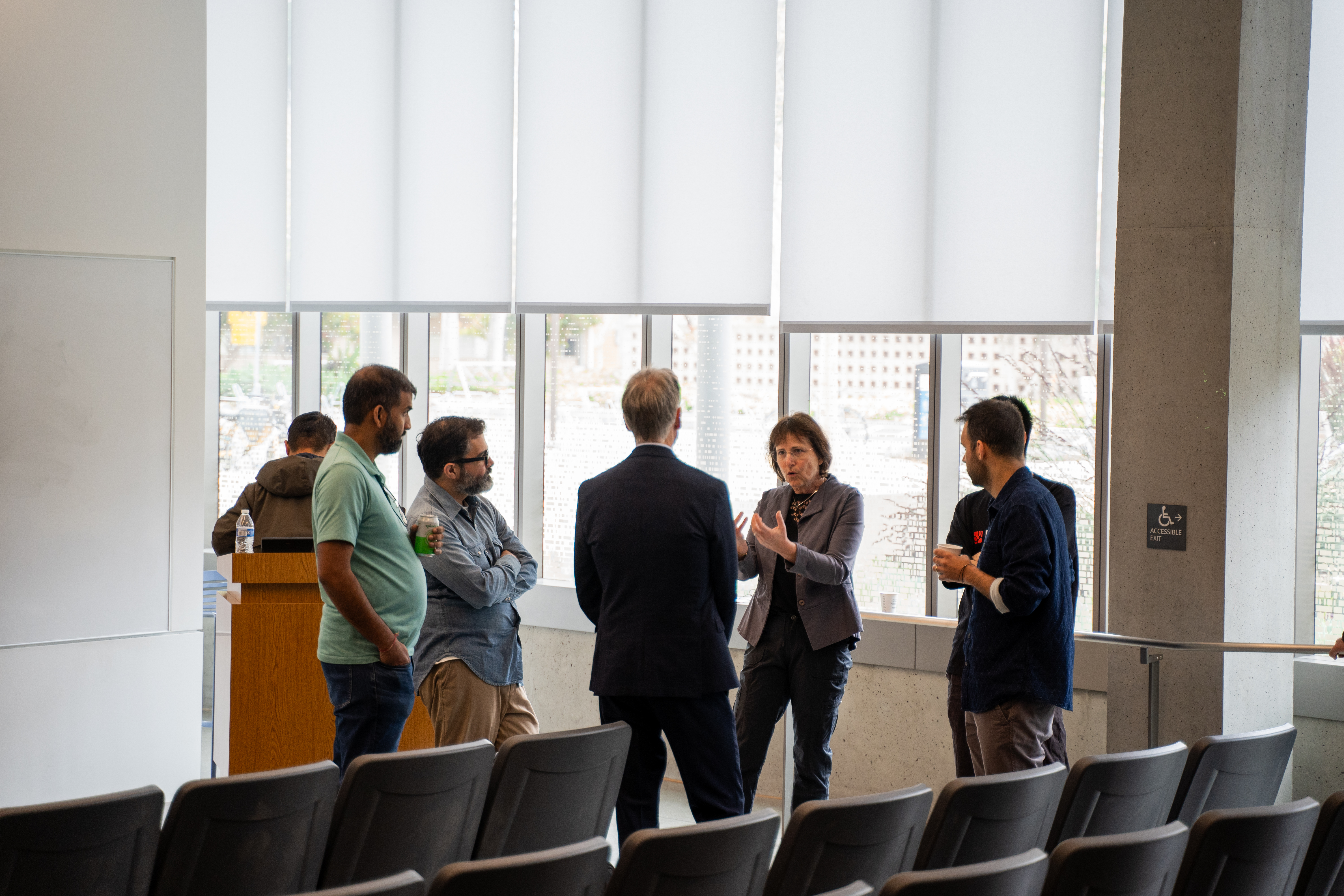 Attendees and presenters conversing