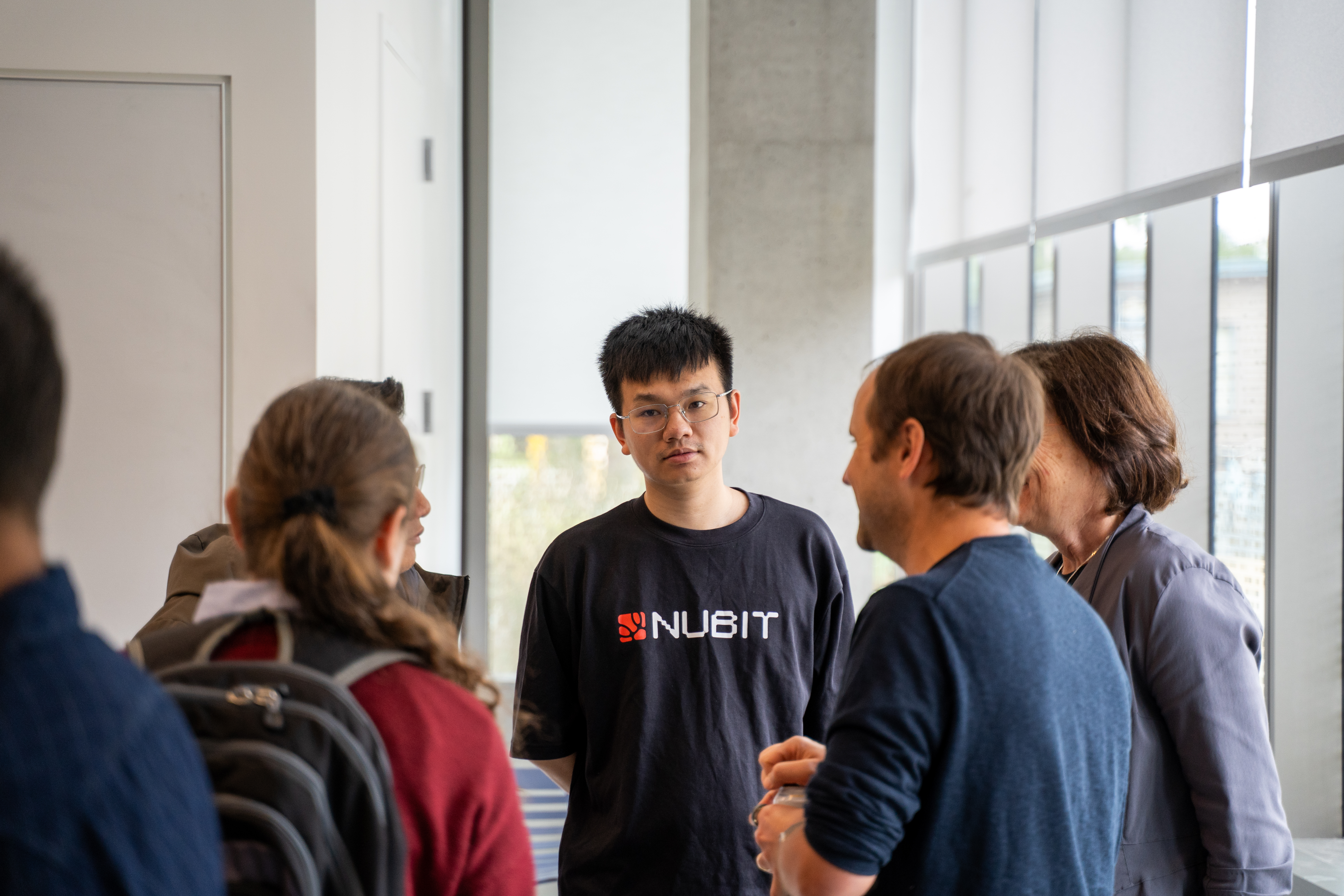 Attendees and presenters conversing