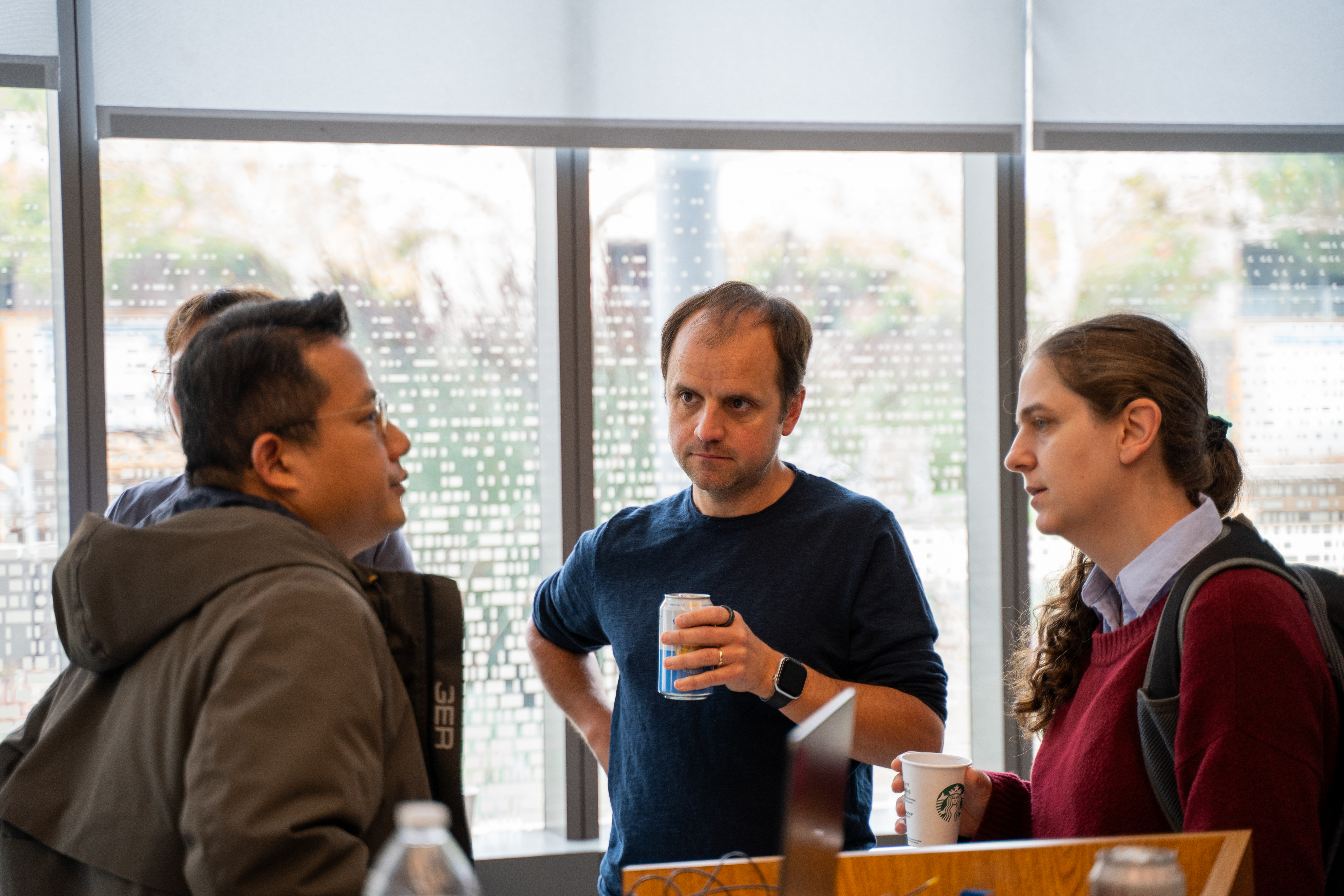 Three people conversing